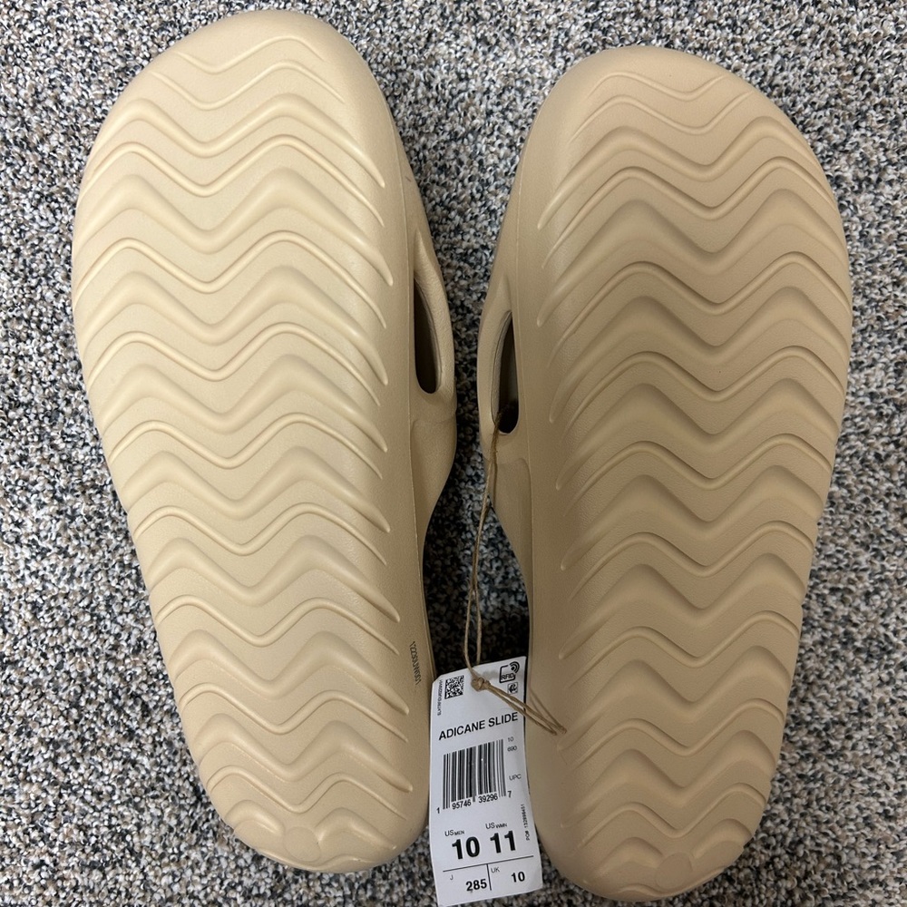 Adidas slides. Mens size 10, women’s size 11. Brand new.